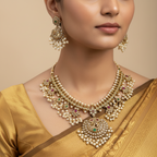 Antique gold-tone necklace set with Kemp stones, crystals and pearl clusters, flat-lay on a white plate