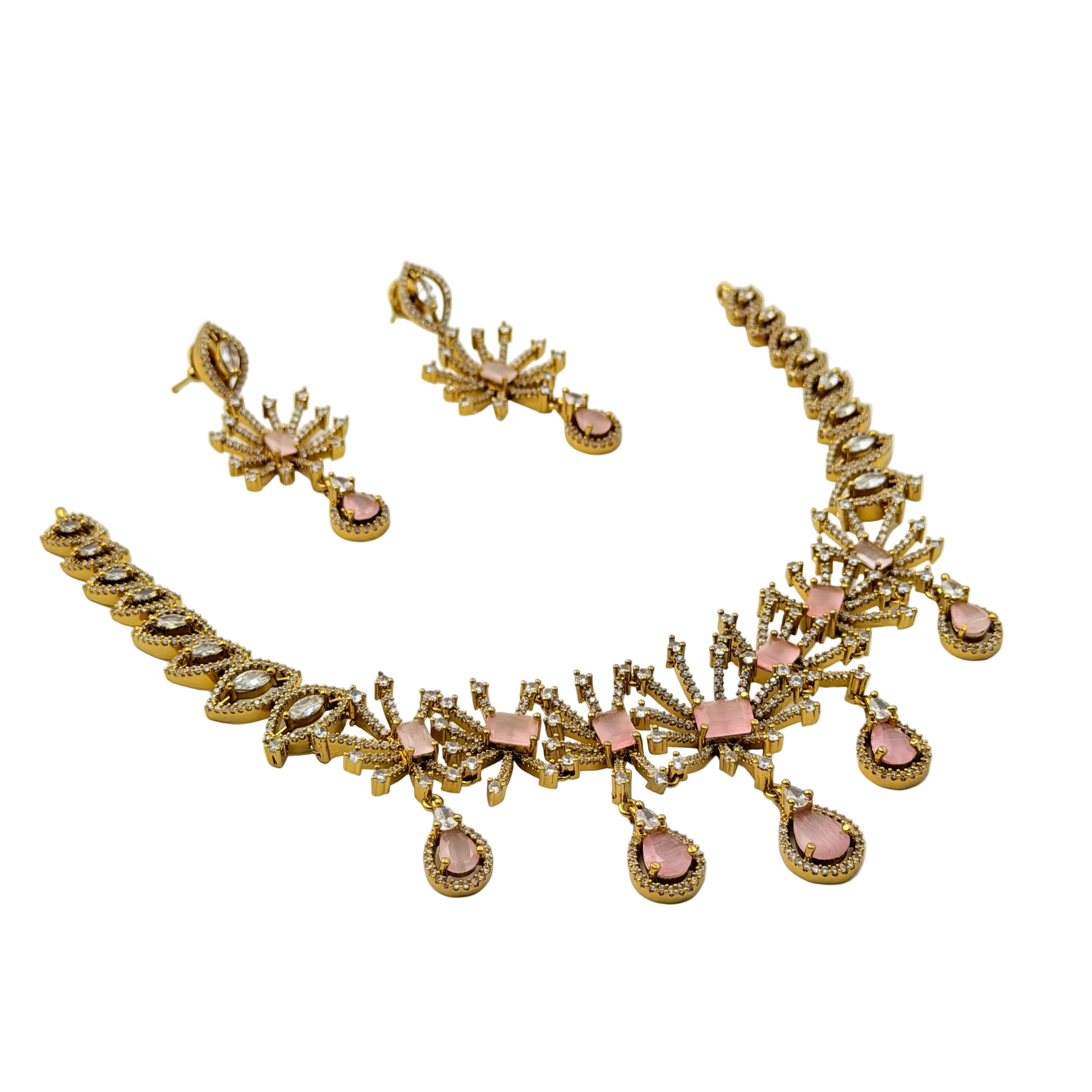 Gold necklace with pink stones on a white background