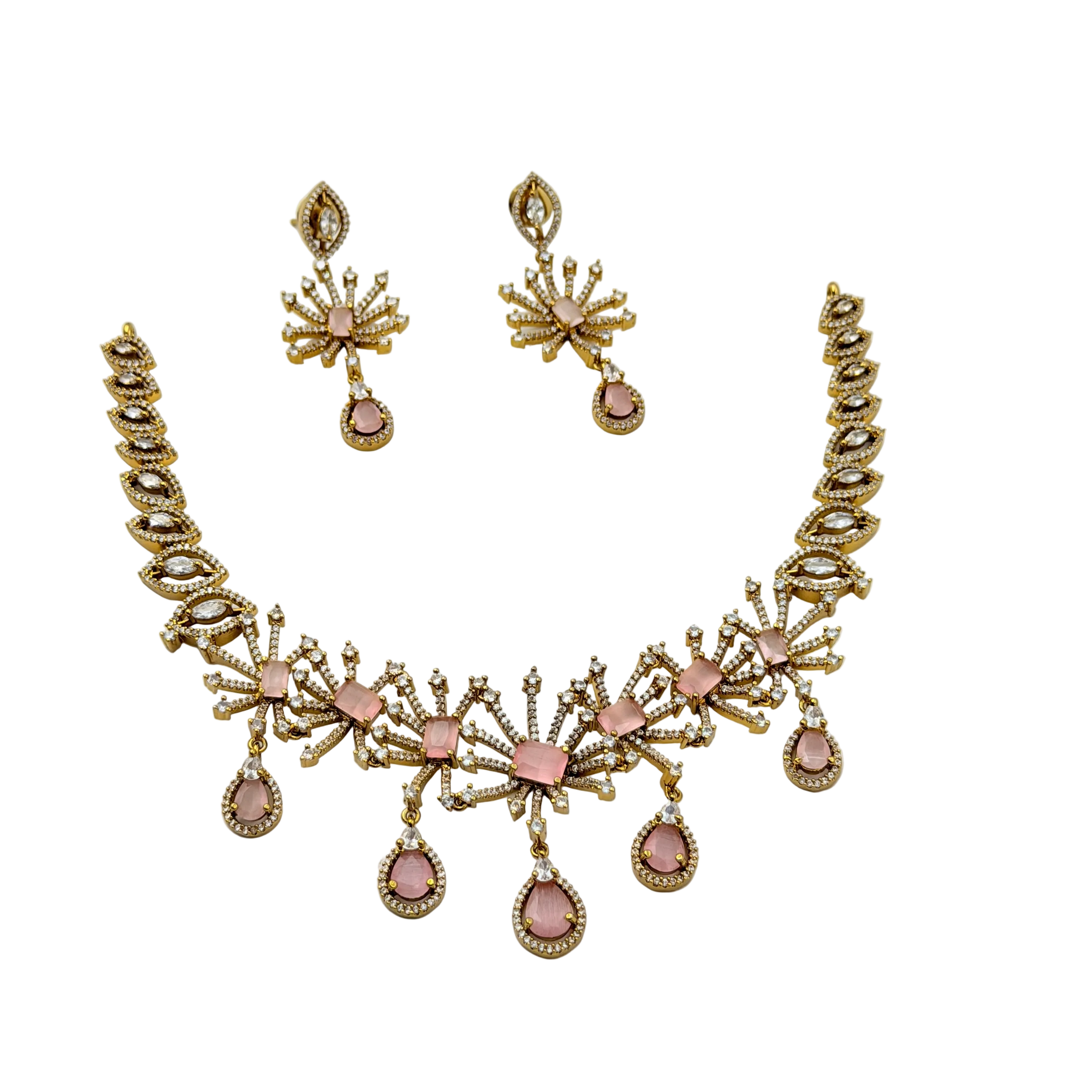 Gold and pink necklace set on a white background