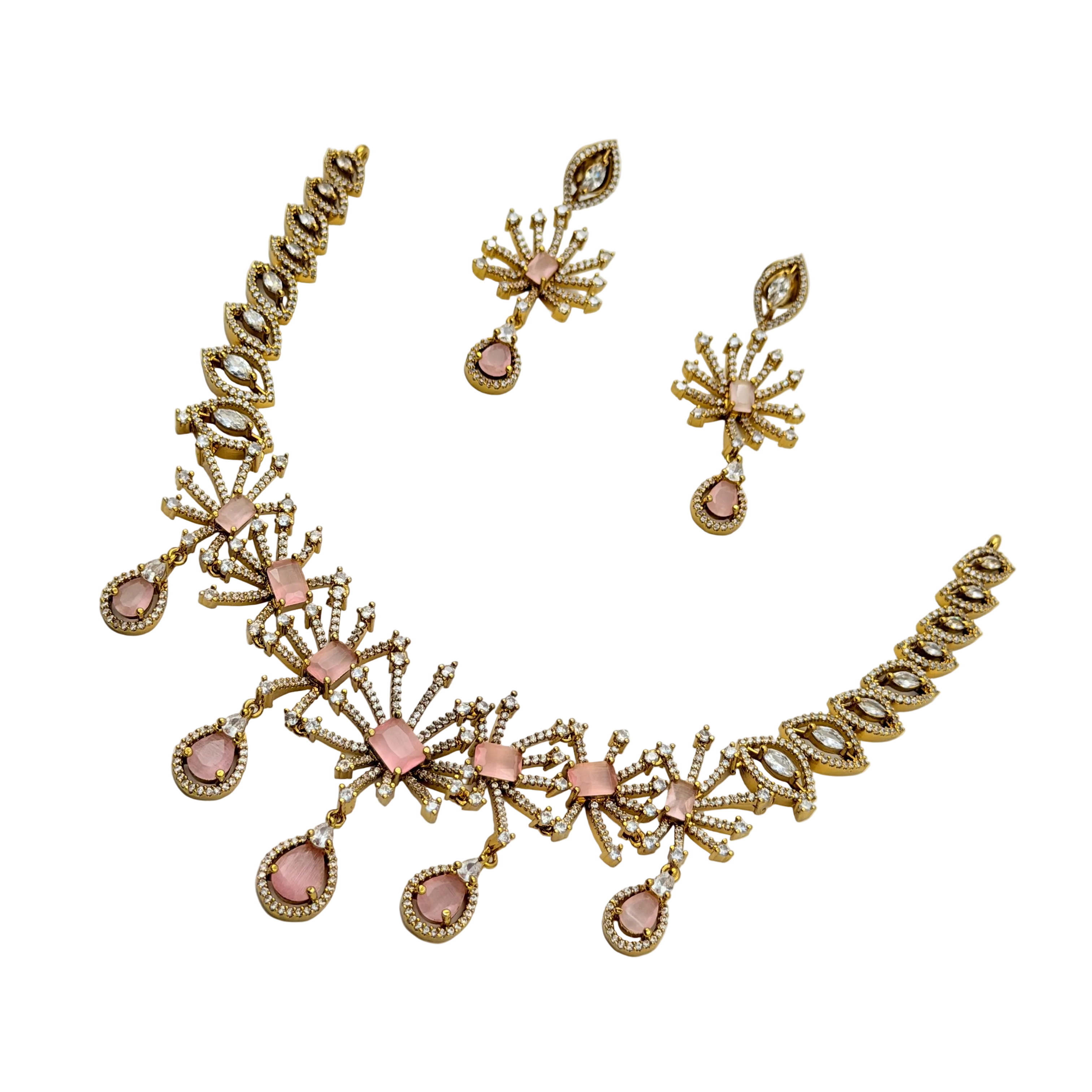 Gold and pink jewelry set with necklace and earrings on a white background