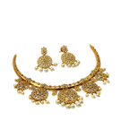 Gold jewelry set with necklace, earrings, and ring on a white background