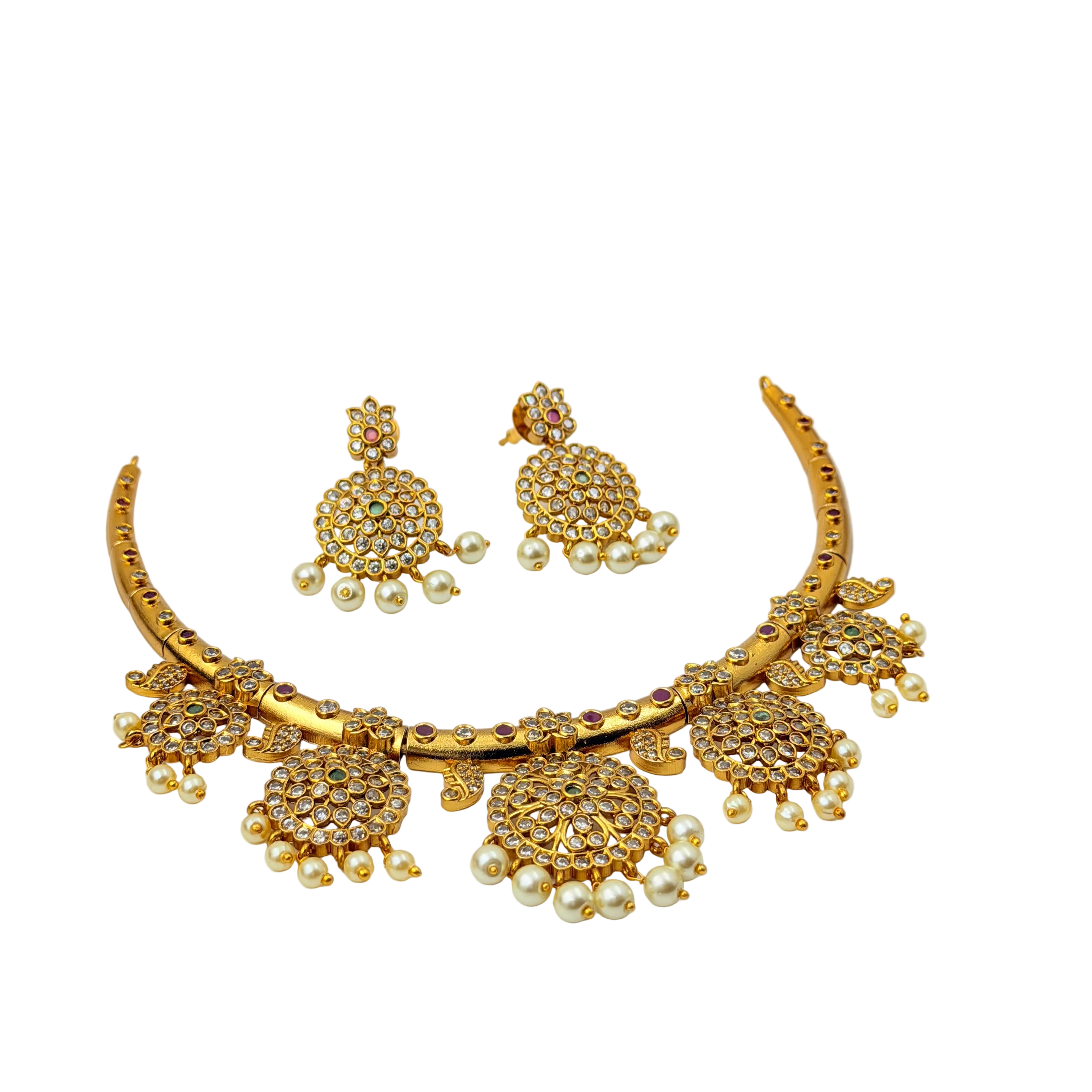 Gold jewelry set with necklace, earrings, and ring on a white background
