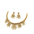 Gold necklace and earrings set on a white background