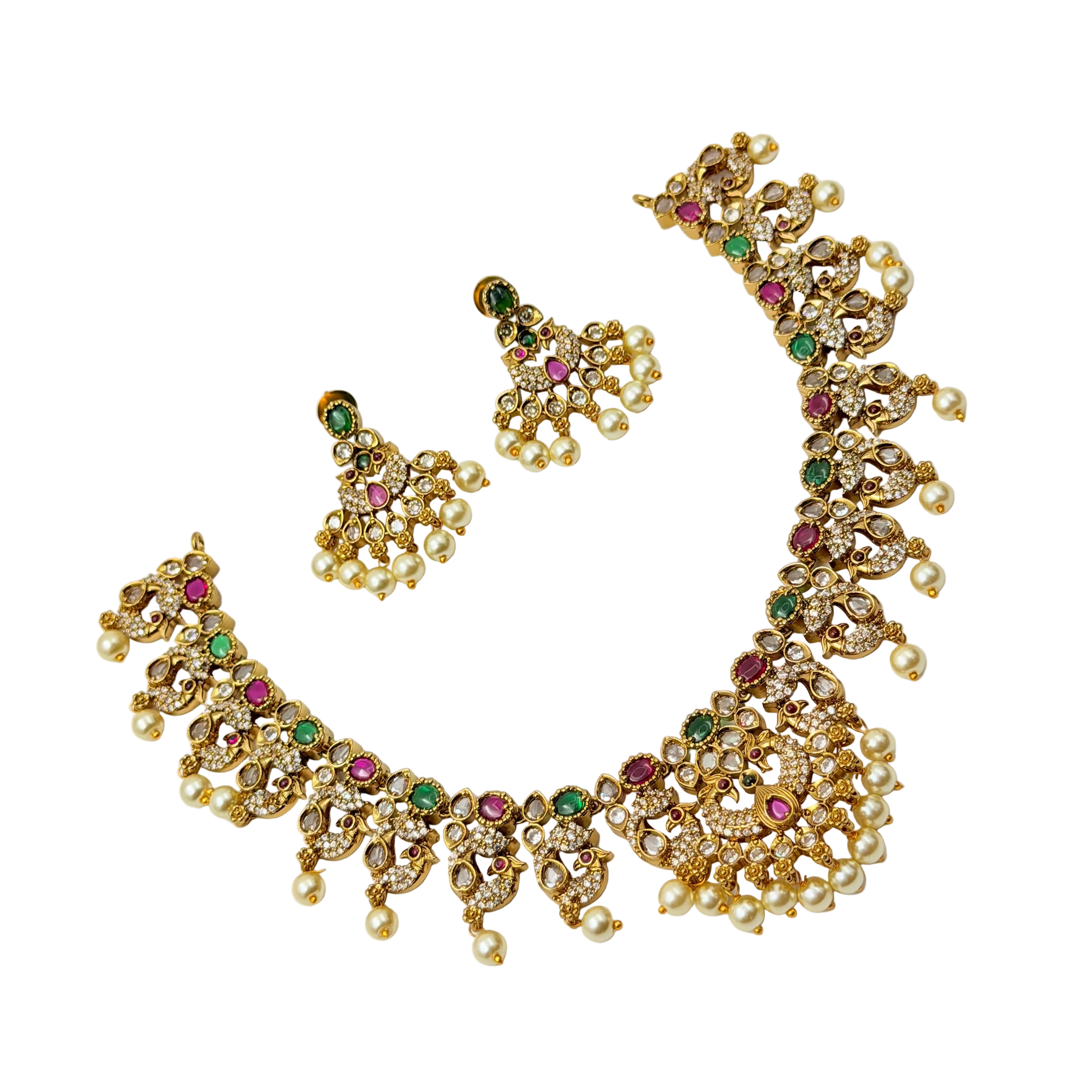 Gold necklace with gemstones and pearl accents on a white background