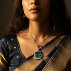 Silver-tone green emerald-cut halo pendant with CZ accents, worn on a model with a navy saree