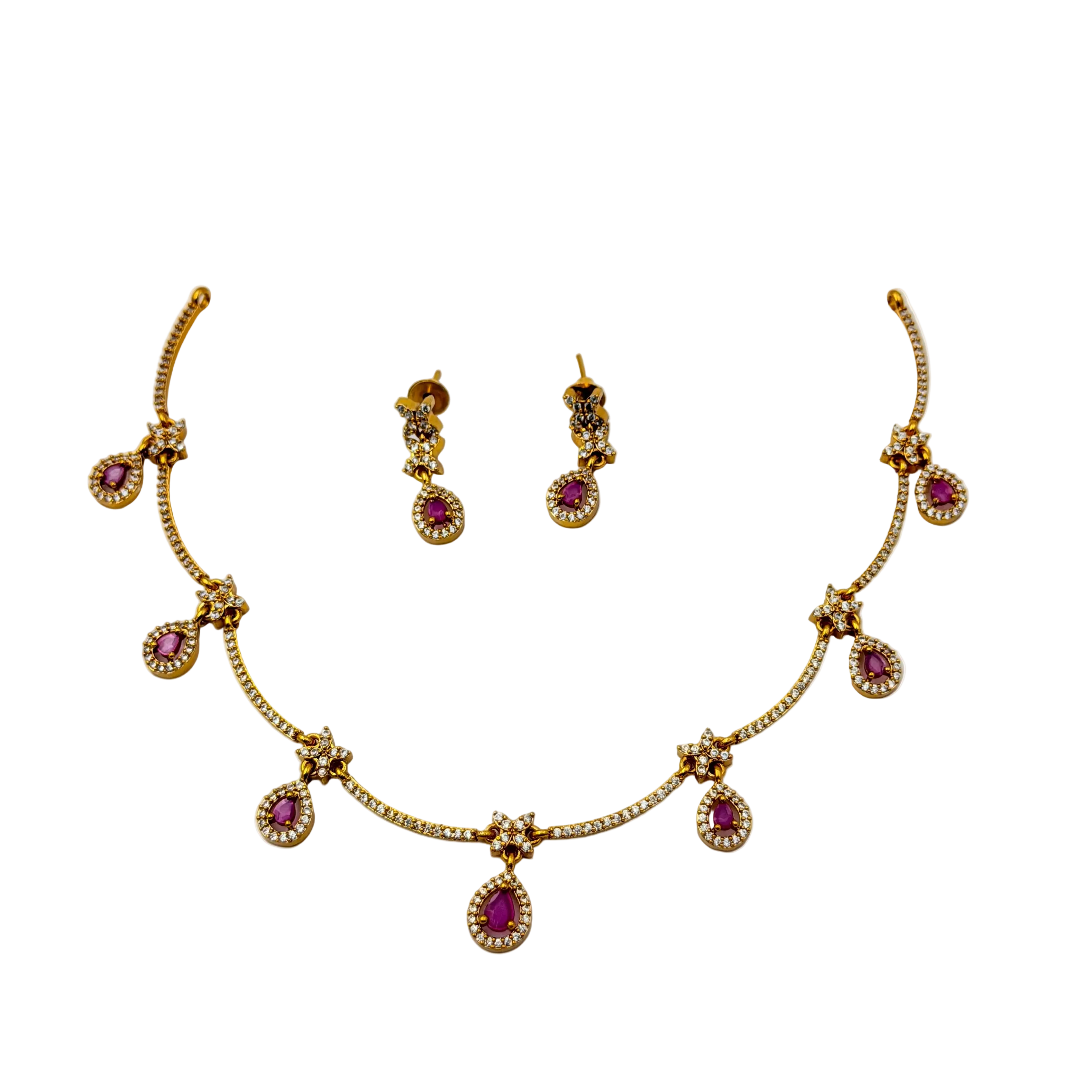 Gold necklace with pink gemstones and matching earrings on a white background