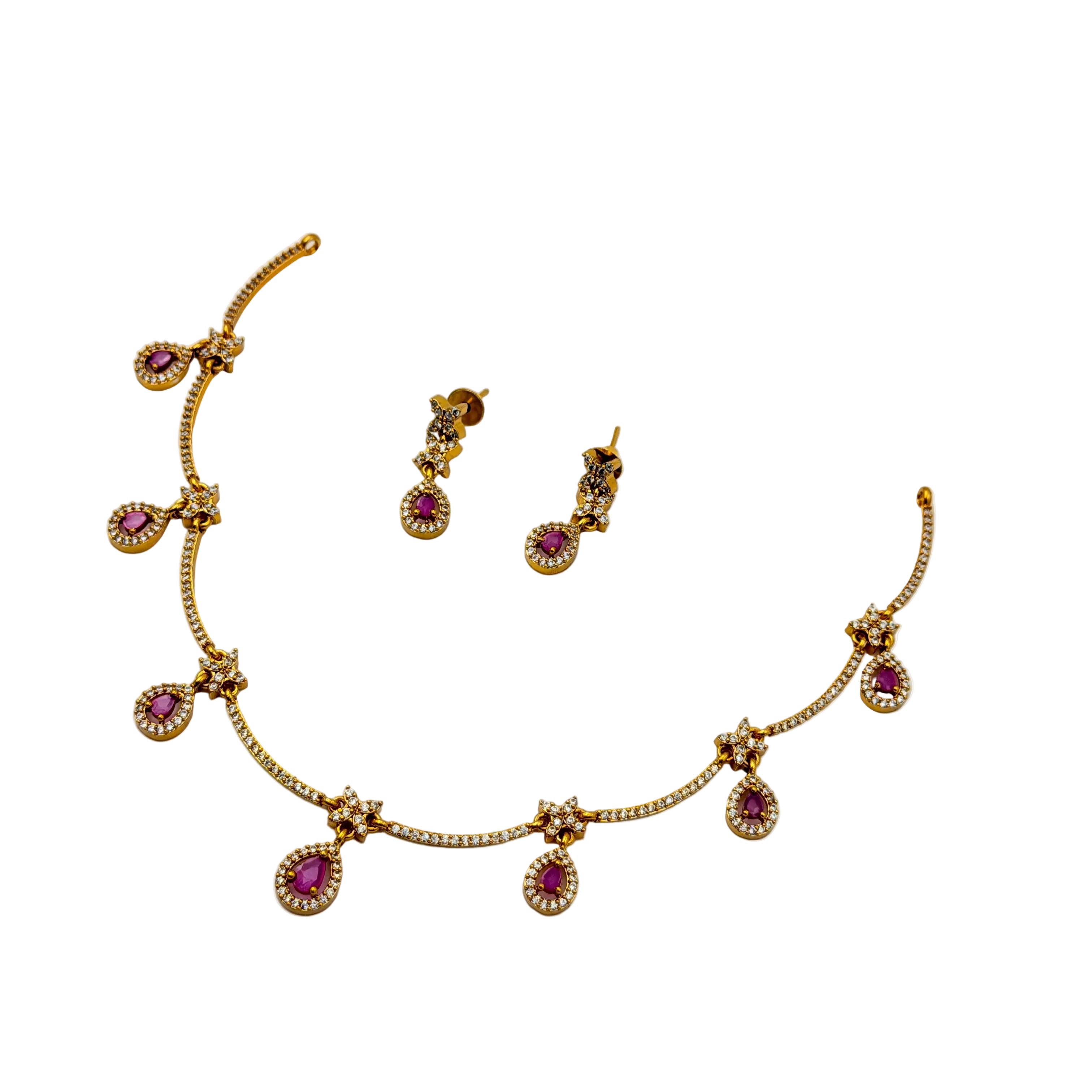 Gold necklace with pink gemstones and matching earrings on a white background