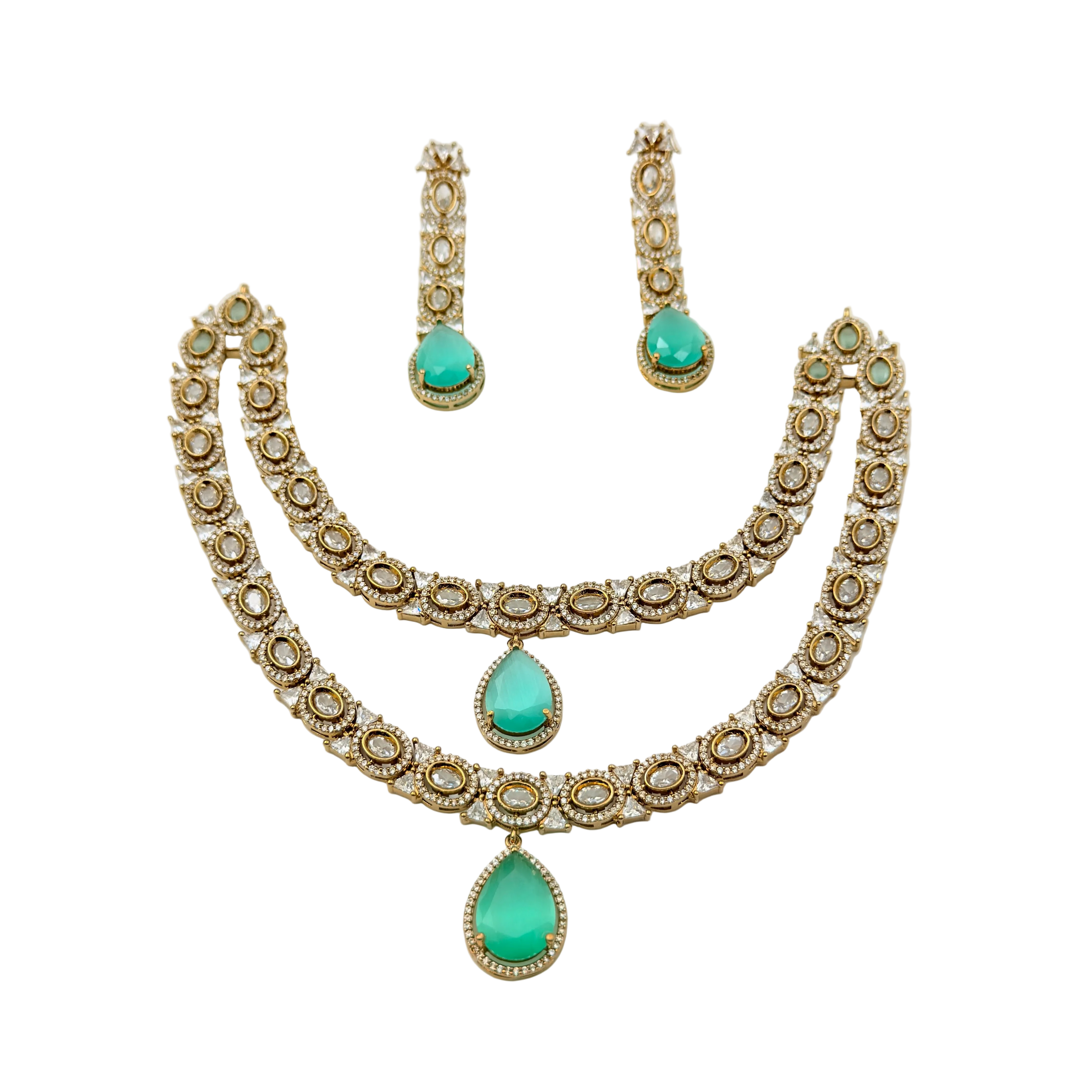 Jewelry set with necklace and earrings featuring turquoise stones on a white background