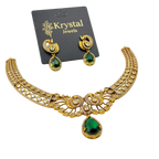 Gold necklace with green gemstones on a Krystal Jewels card