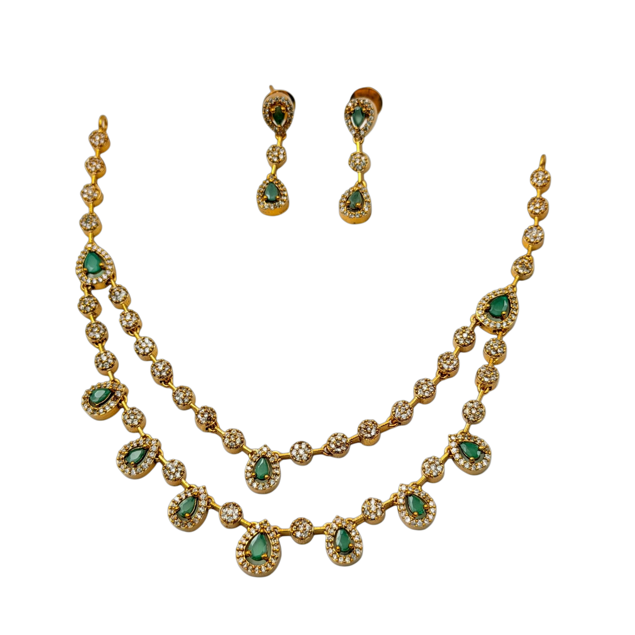 Gold necklace with green gemstones and matching earrings on a white background