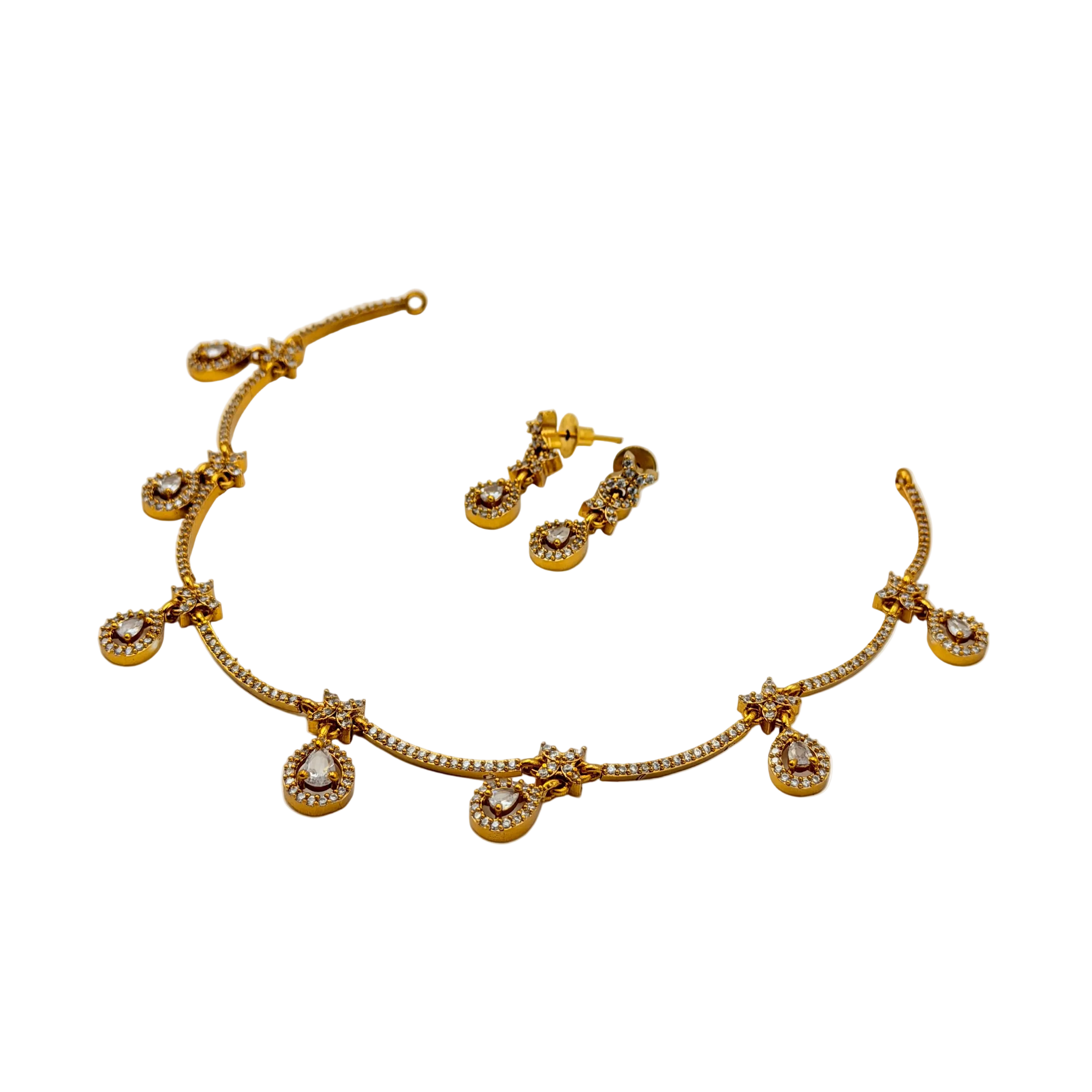 Gold necklace and earrings set on a white background
