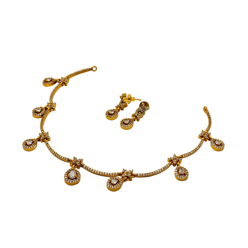 Gold necklace and earrings set on a white background