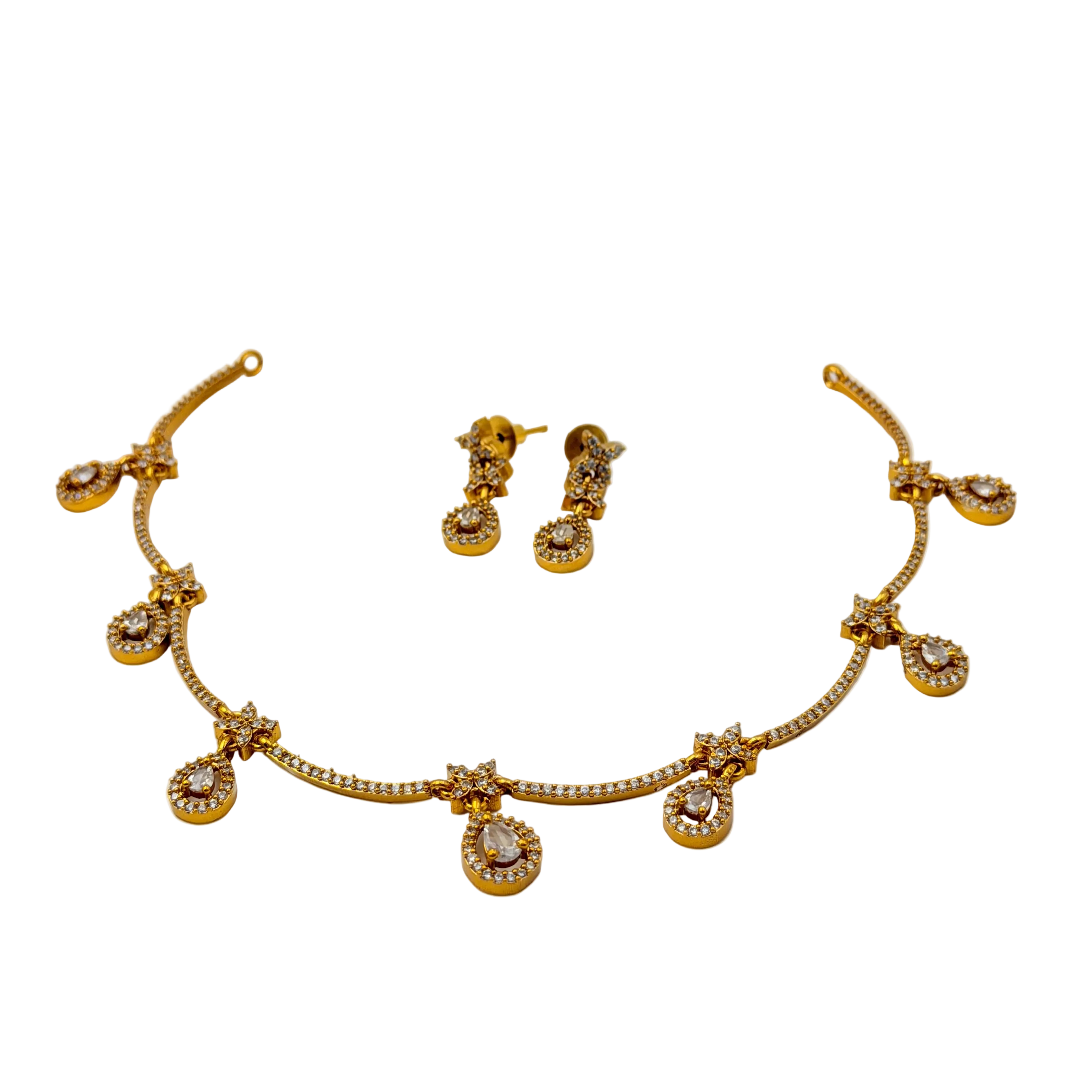Gold necklace and earrings set on a white background