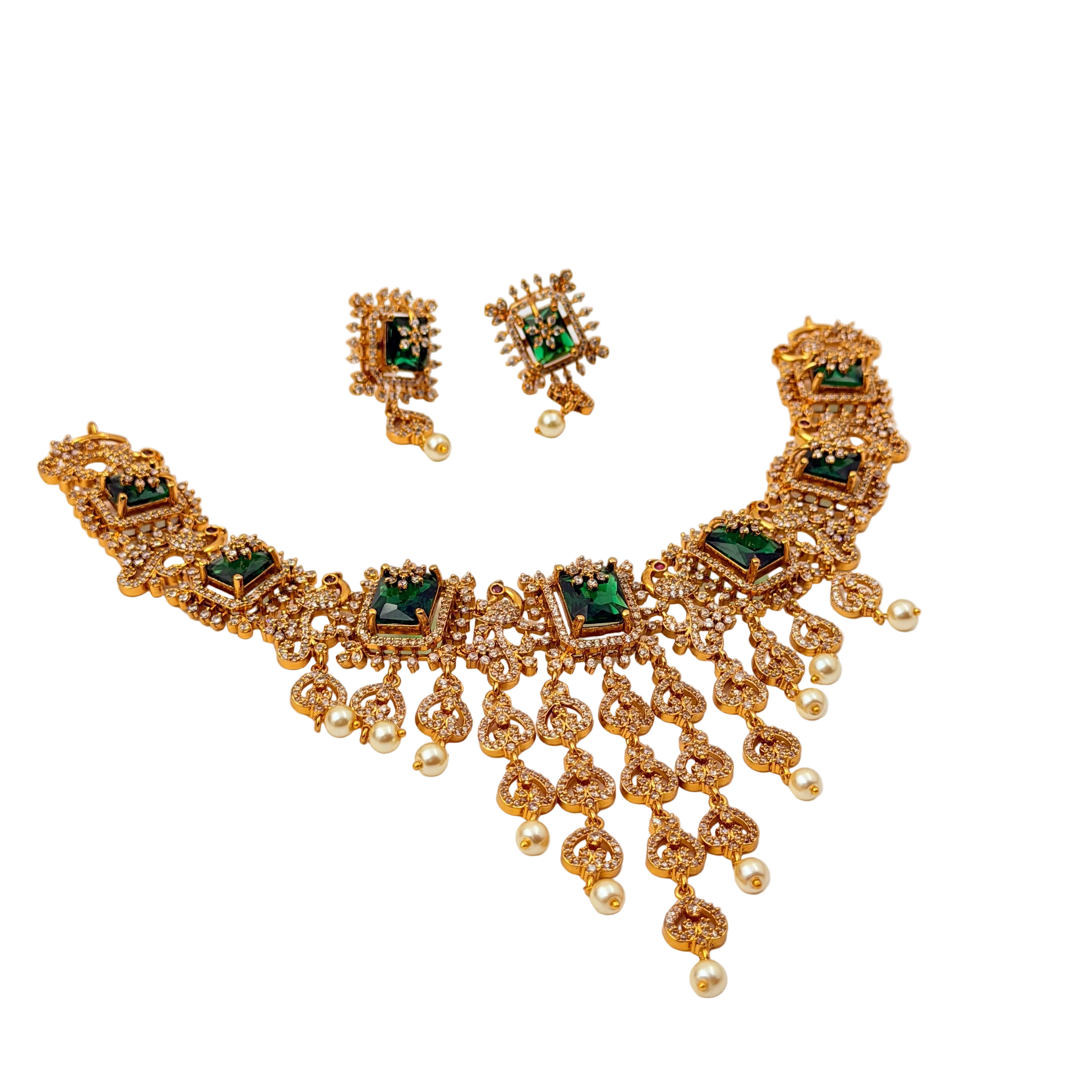 Gold necklace with green gemstones and matching earrings on a white background