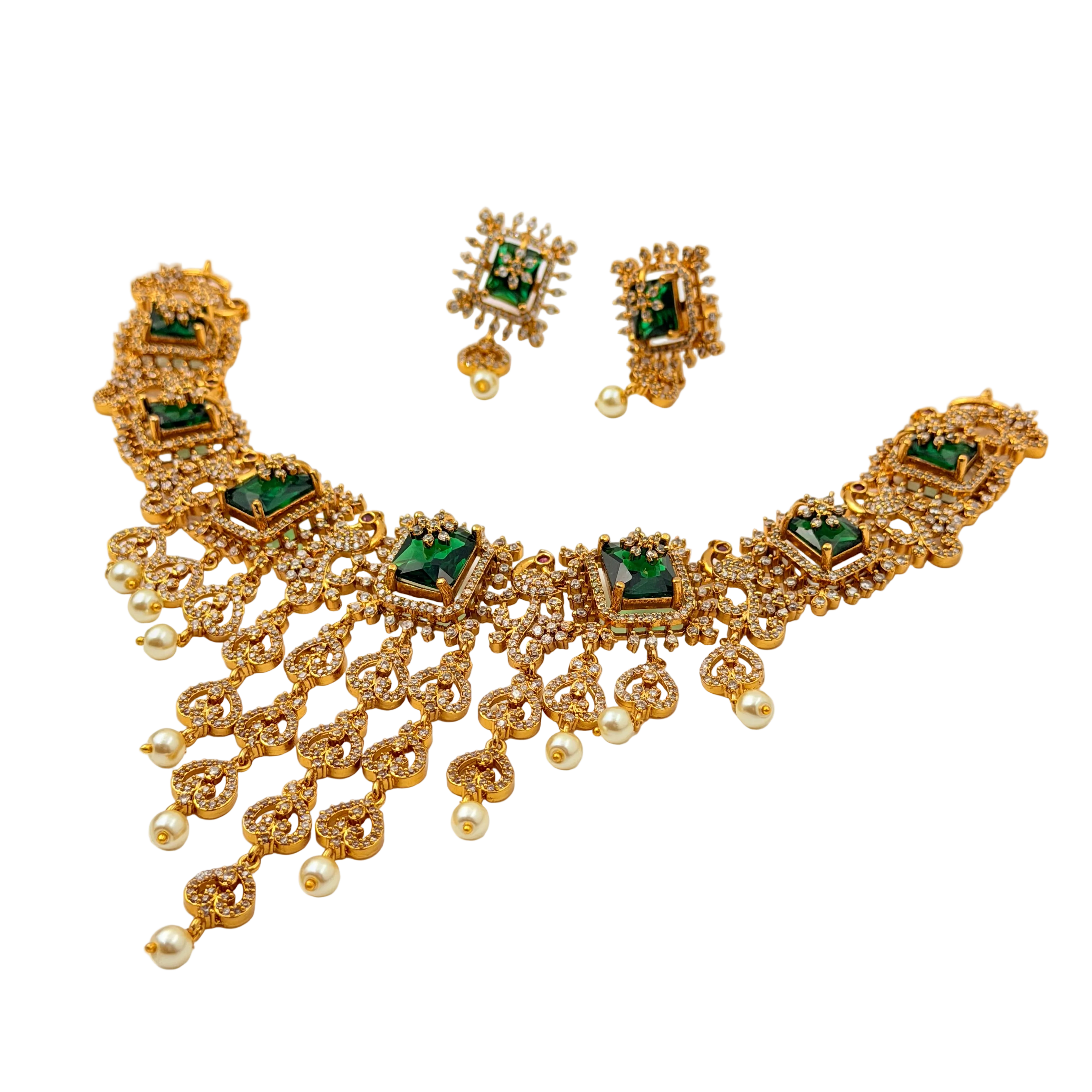 Gold necklace with green gemstones and matching earrings on a white background