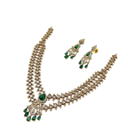 Jewelry set with necklace and earrings on a white background