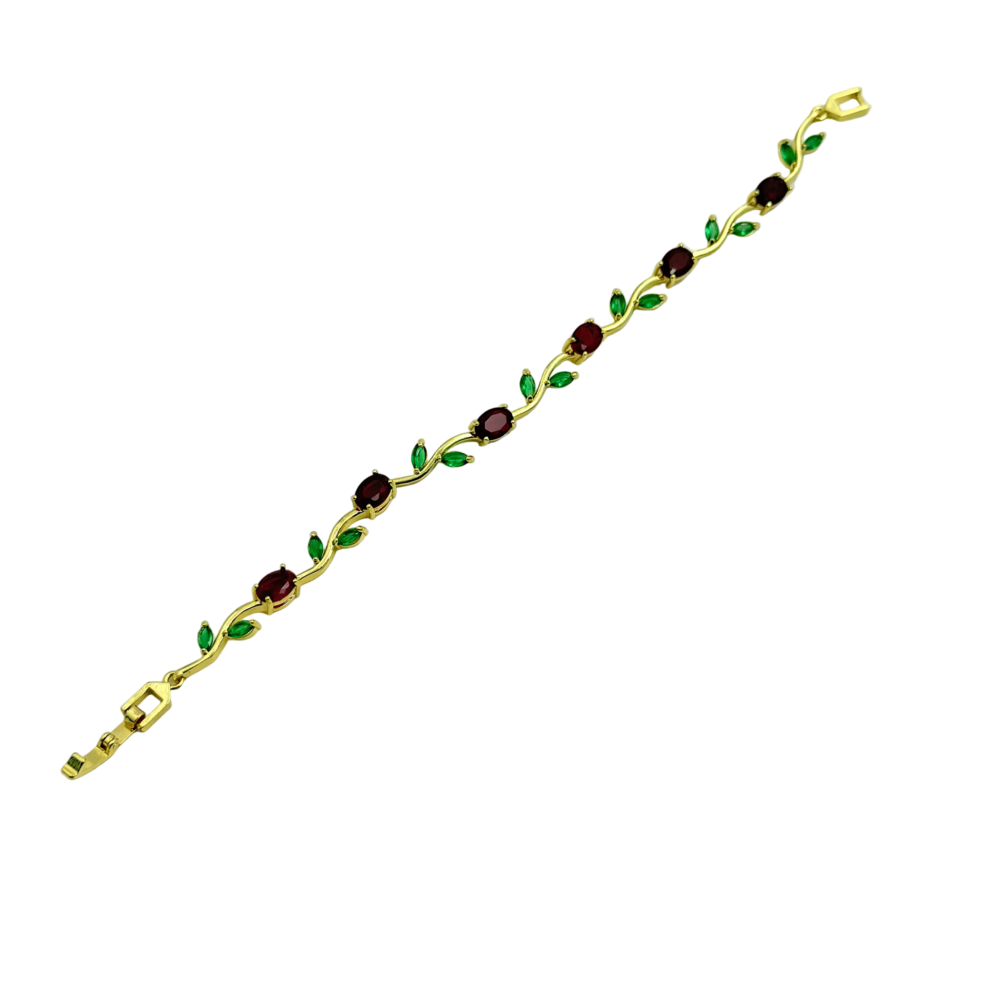 Gold bracelet with green and red gemstones on a white background