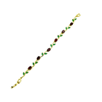 Gold bracelet with green and red gemstones on a white background