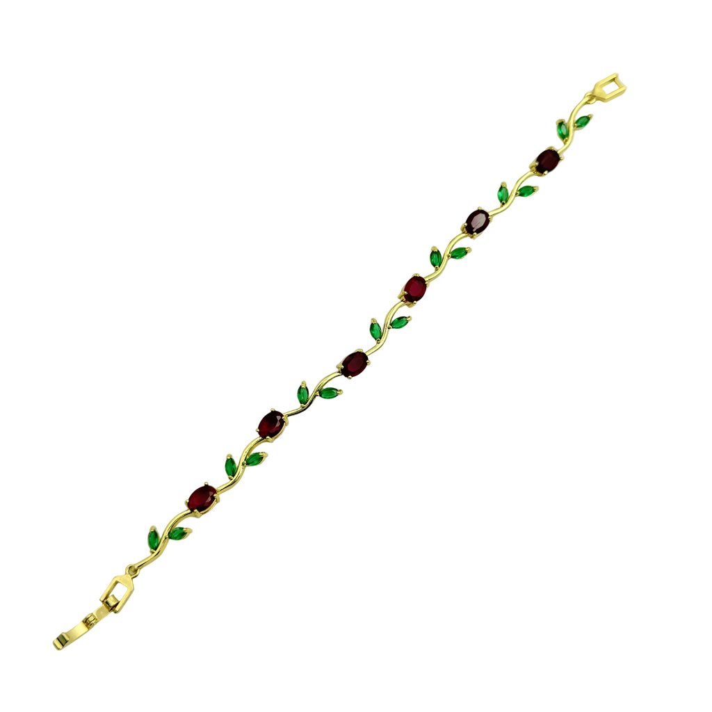 Gold bracelet with embedded red, green, and purple stones on a white background