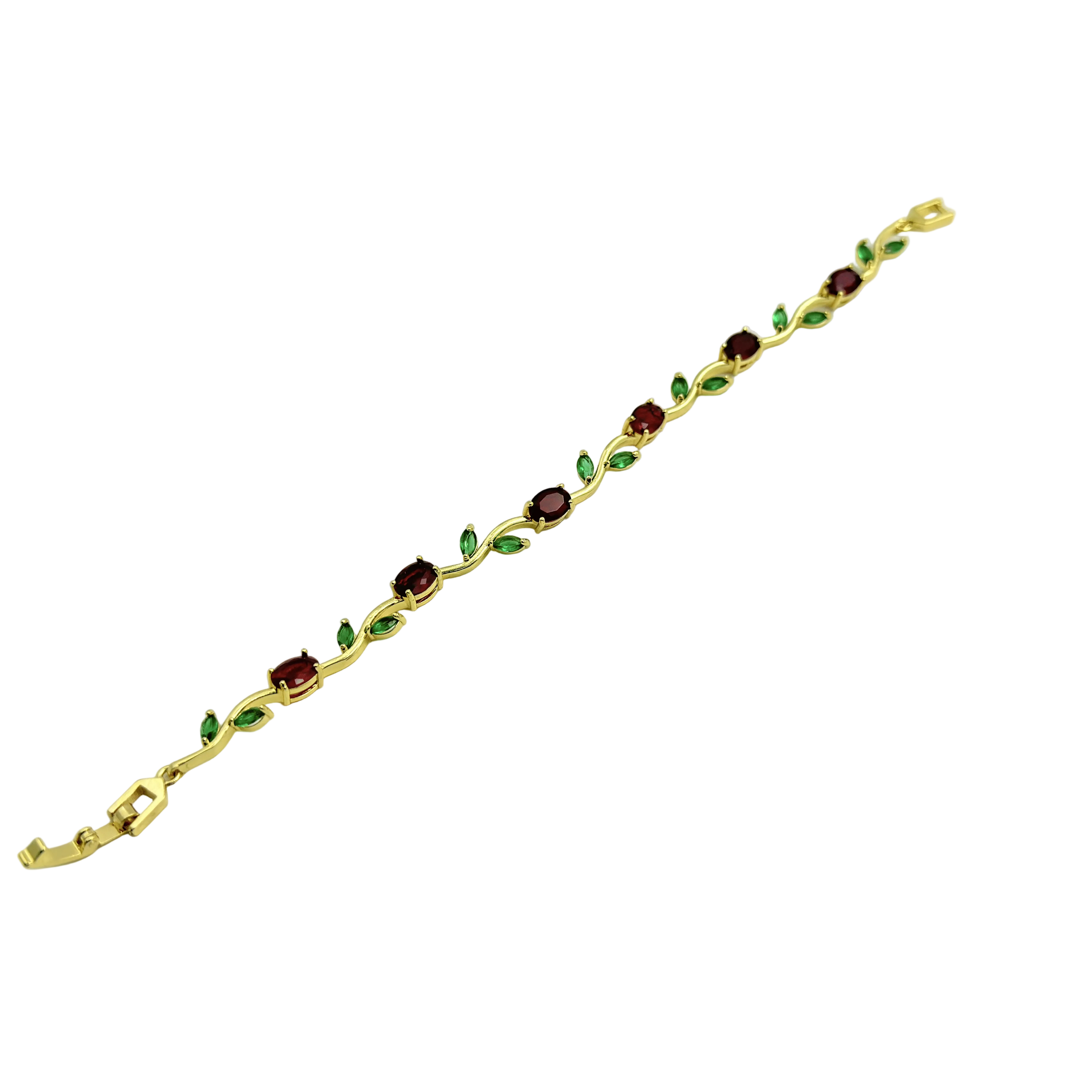 Gold bracelet with green and red gemstones on a white background
