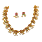 Gold necklace with pearl and gemstone accents on a transparent background