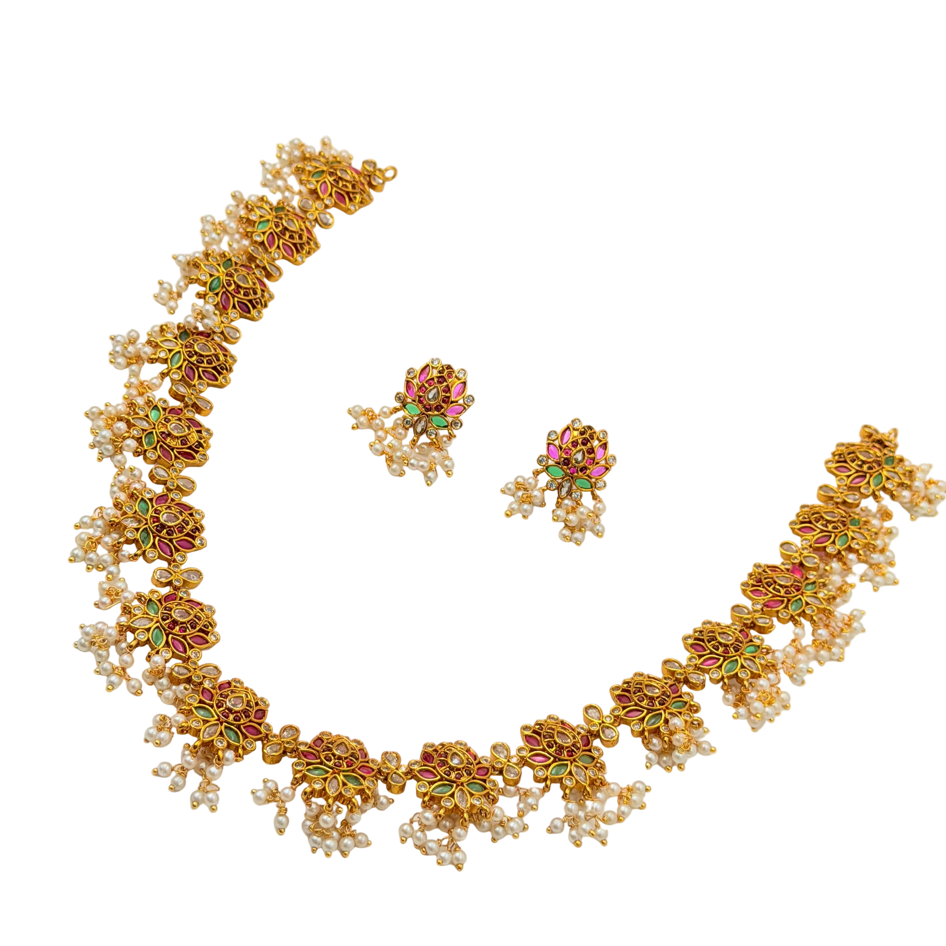 Gold necklace and earrings set on a white background