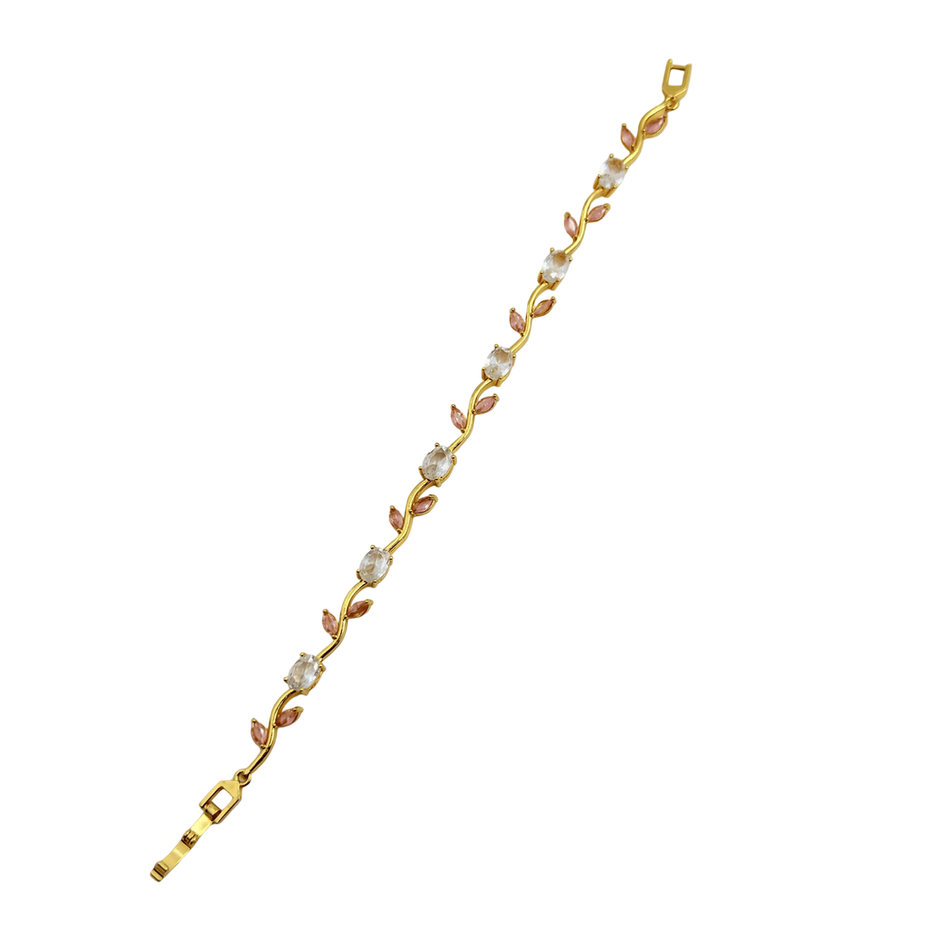 Gold bracelet with floral design on a white background