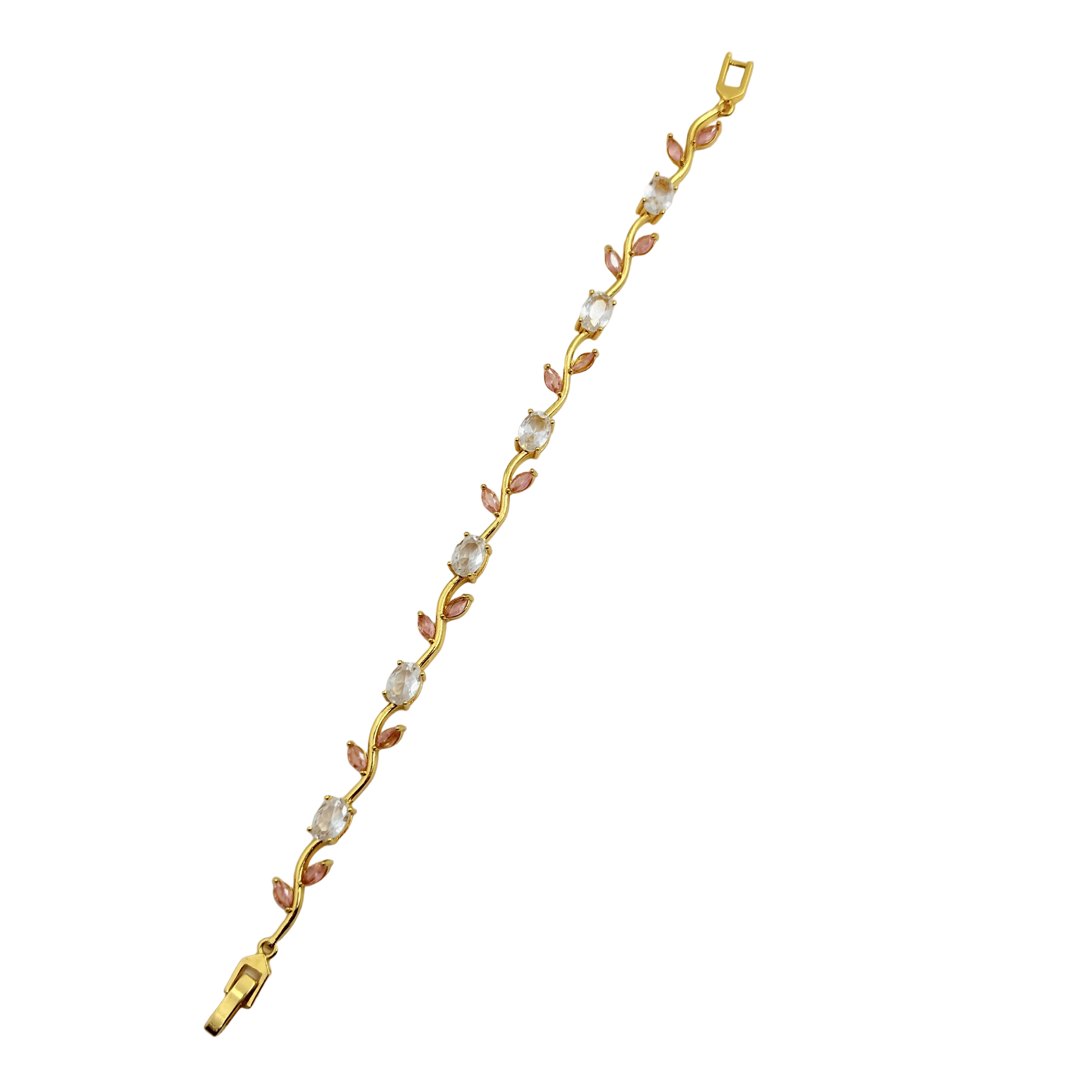 Gold bracelet with pink and white stones on a black background