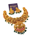 Ornate gold necklace with green and red accents on a white background, featuring Krystal Jewels packaging.