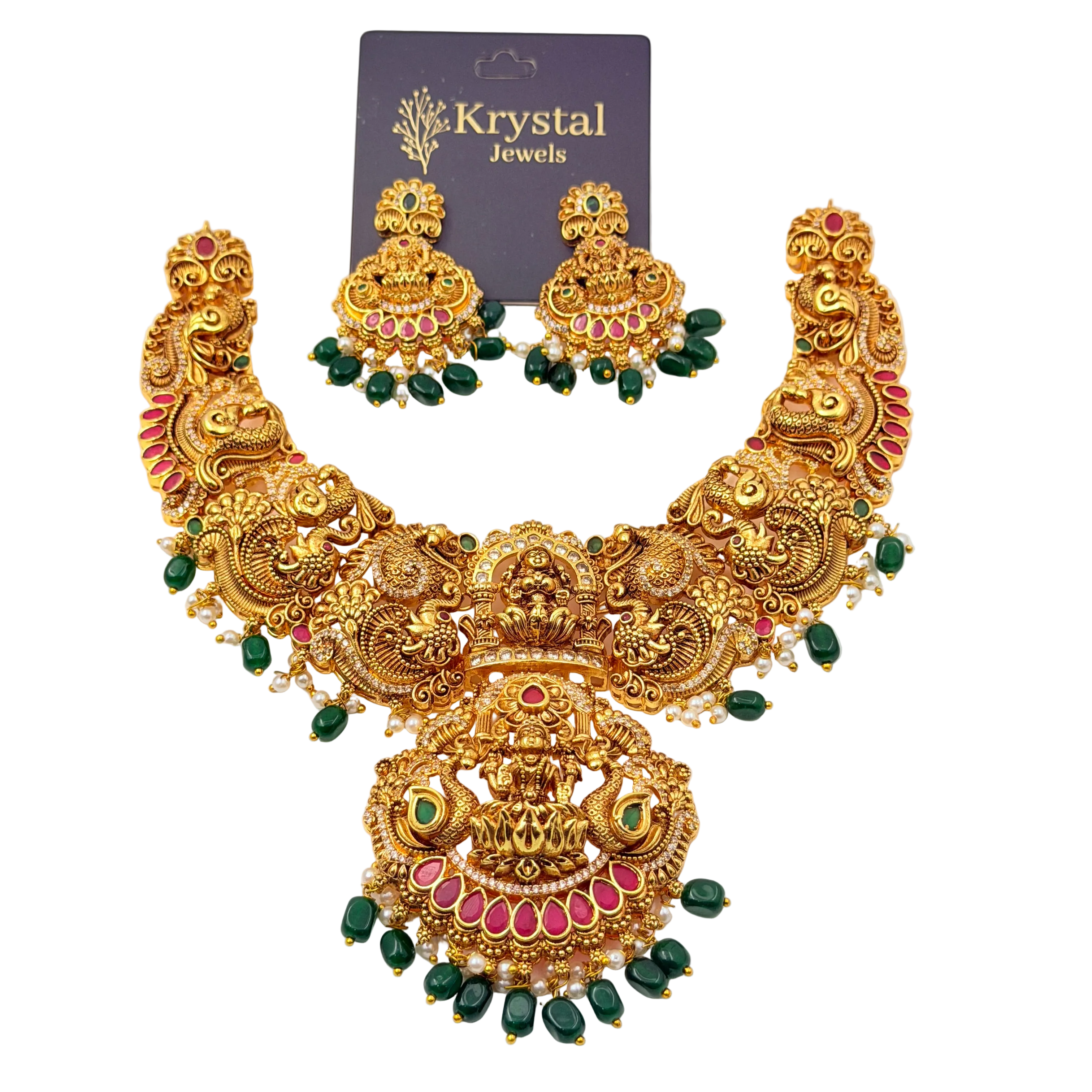 Gold necklace with green and red stones on a white background, branded as Krystal Jewels.