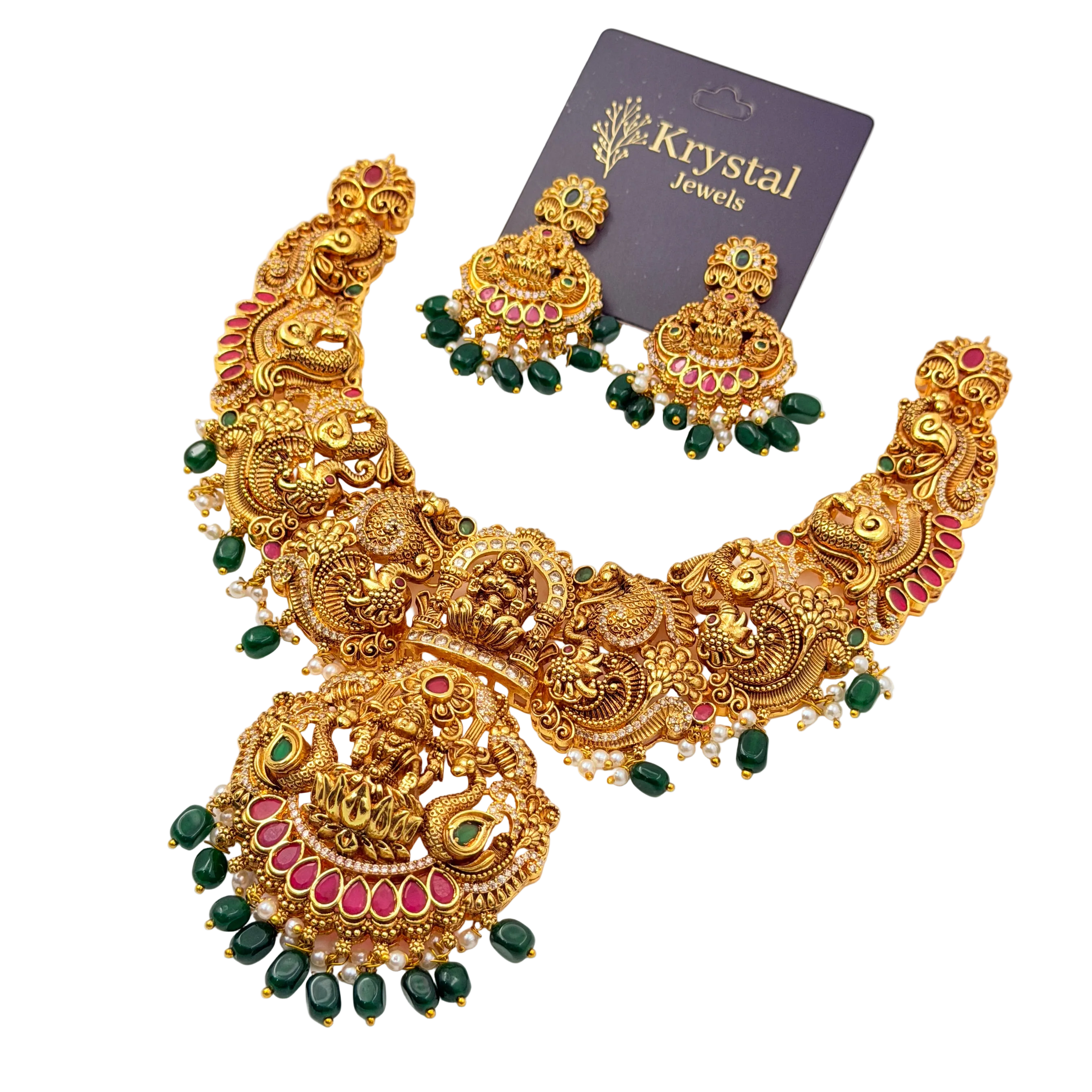 Ornate gold necklace with green and red stones on a transparent background, branded 'Krystal Jewels'.