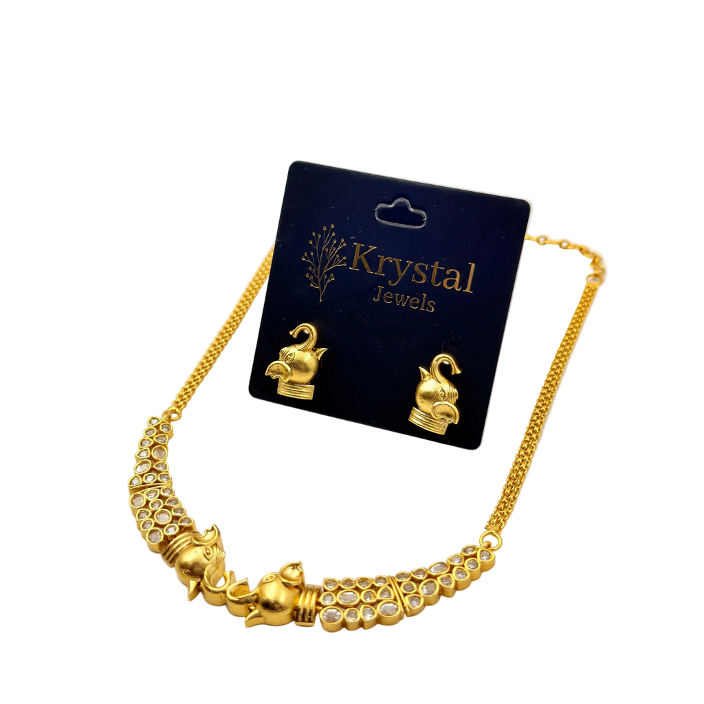 Gold necklace with elephant designs on a 'Krystal Jewels' card