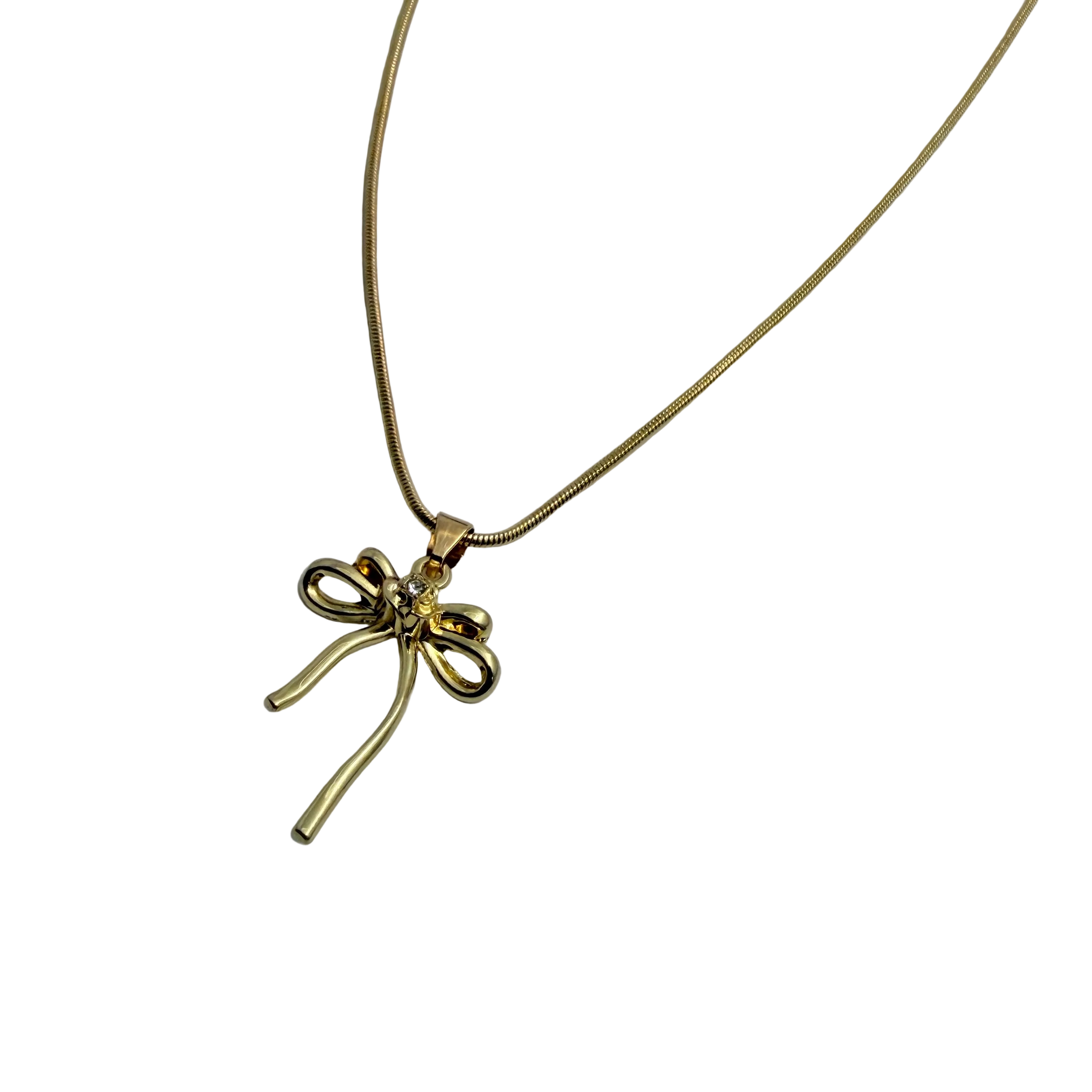 Gold-tone bowknot pendant necklace with clear crystal accent, worn on model's neckline showing chain length