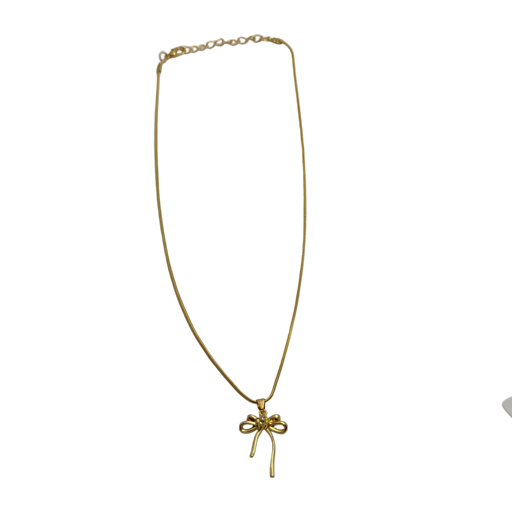 Gold-tone snake chain necklace with bowknot pendant, full flat-lay view showing extendable clasp
