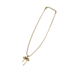 Gold-tone bowknot pendant necklace close-up on white background, full length view
