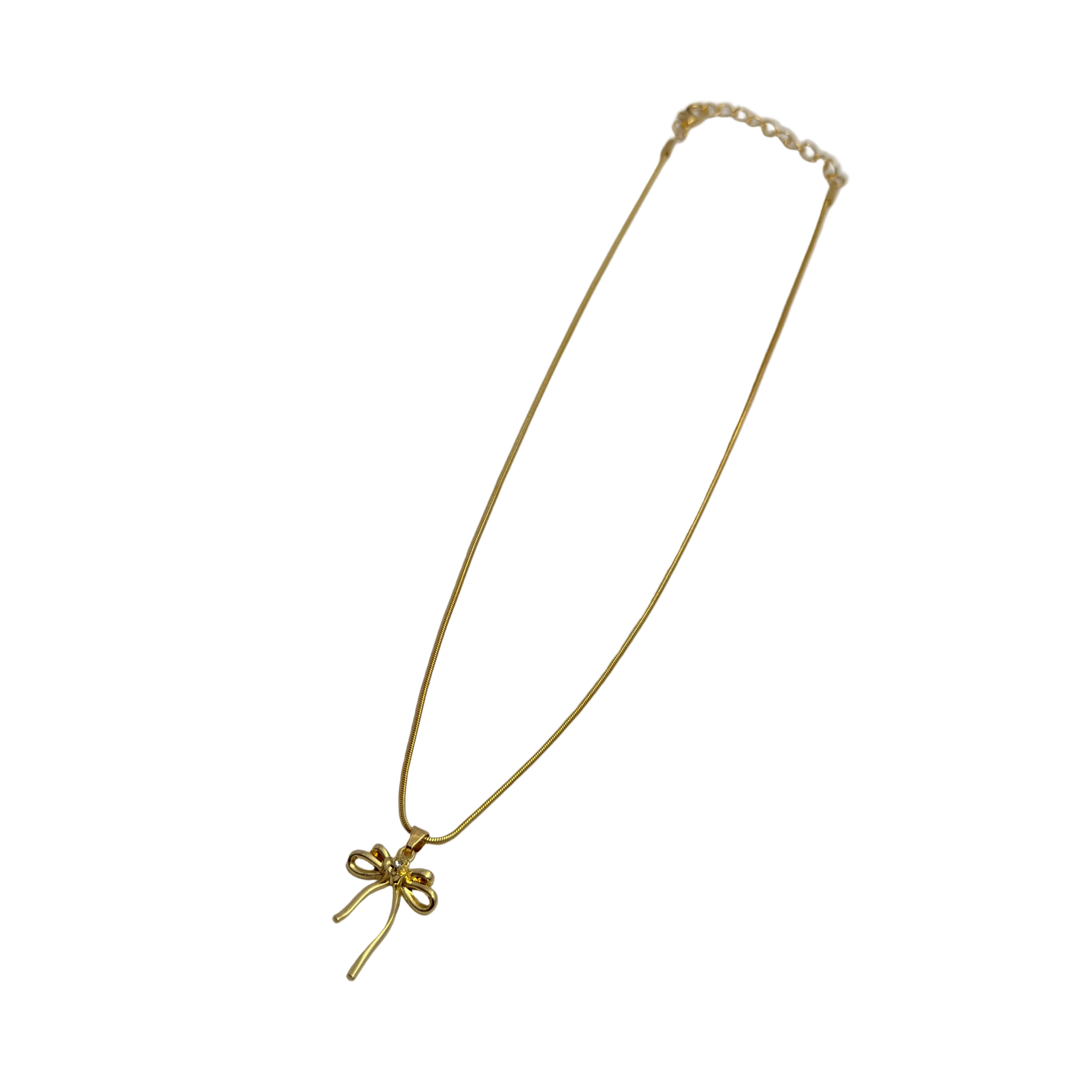 Gold-tone bowknot pendant necklace close-up on white background, full length view