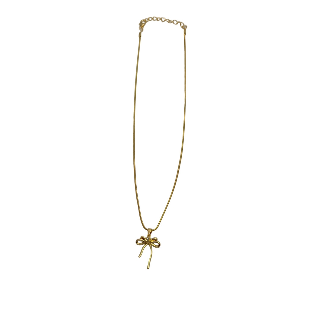 Gold-tone bowknot pendant necklace with clear crystal center, flat-lay view of chain and clasp
