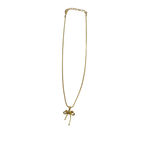Gold-tone bowknot pendant necklace with clear crystal center, flat-lay view of chain and clasp