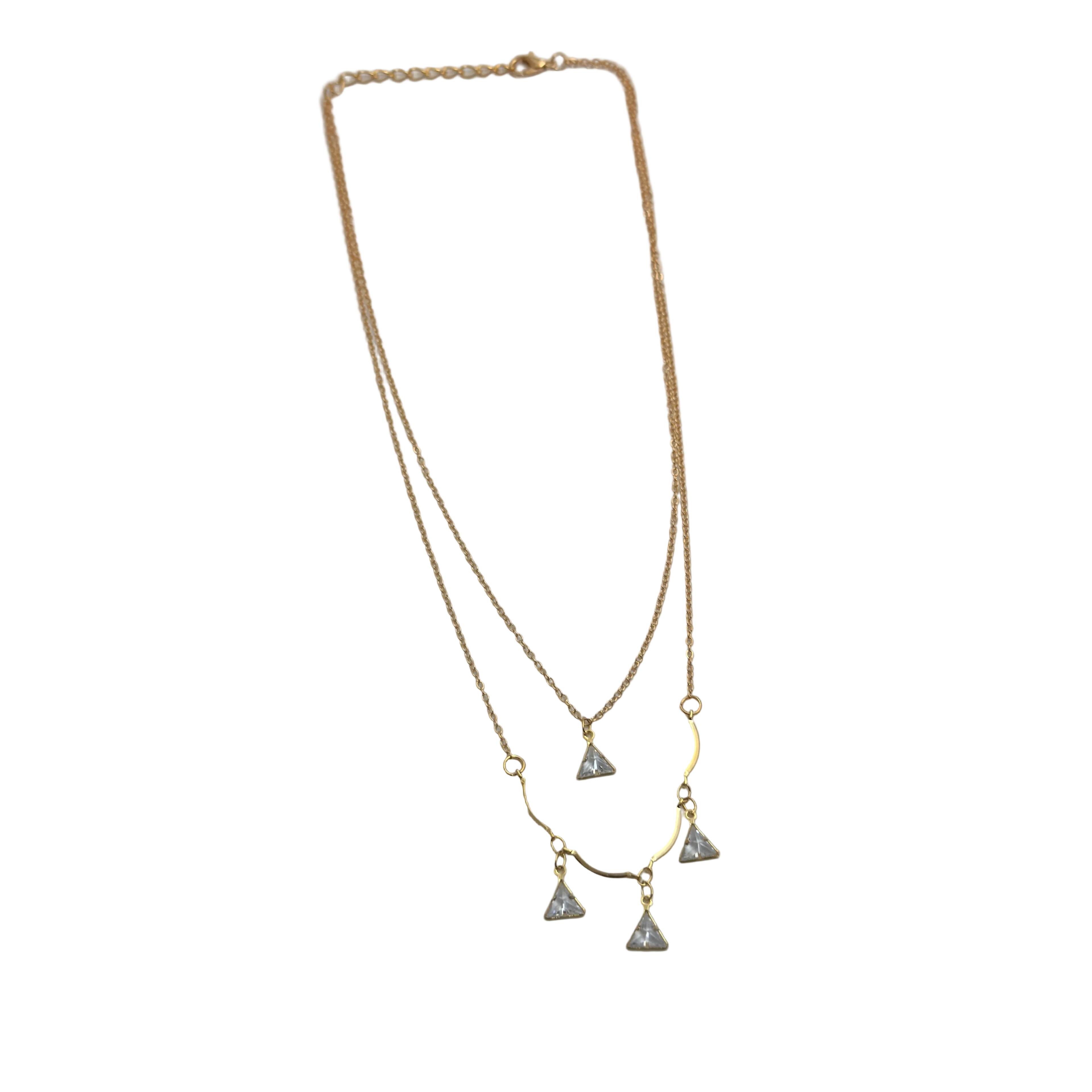 Gold-tone double-layered necklace with wavy bar and four trillion-cut crystal charms, flat lay on black background