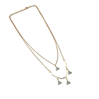 Gold-tone double-layered necklace with wavy bar and four trillion-cut crystal charms, angled flat lay on black background