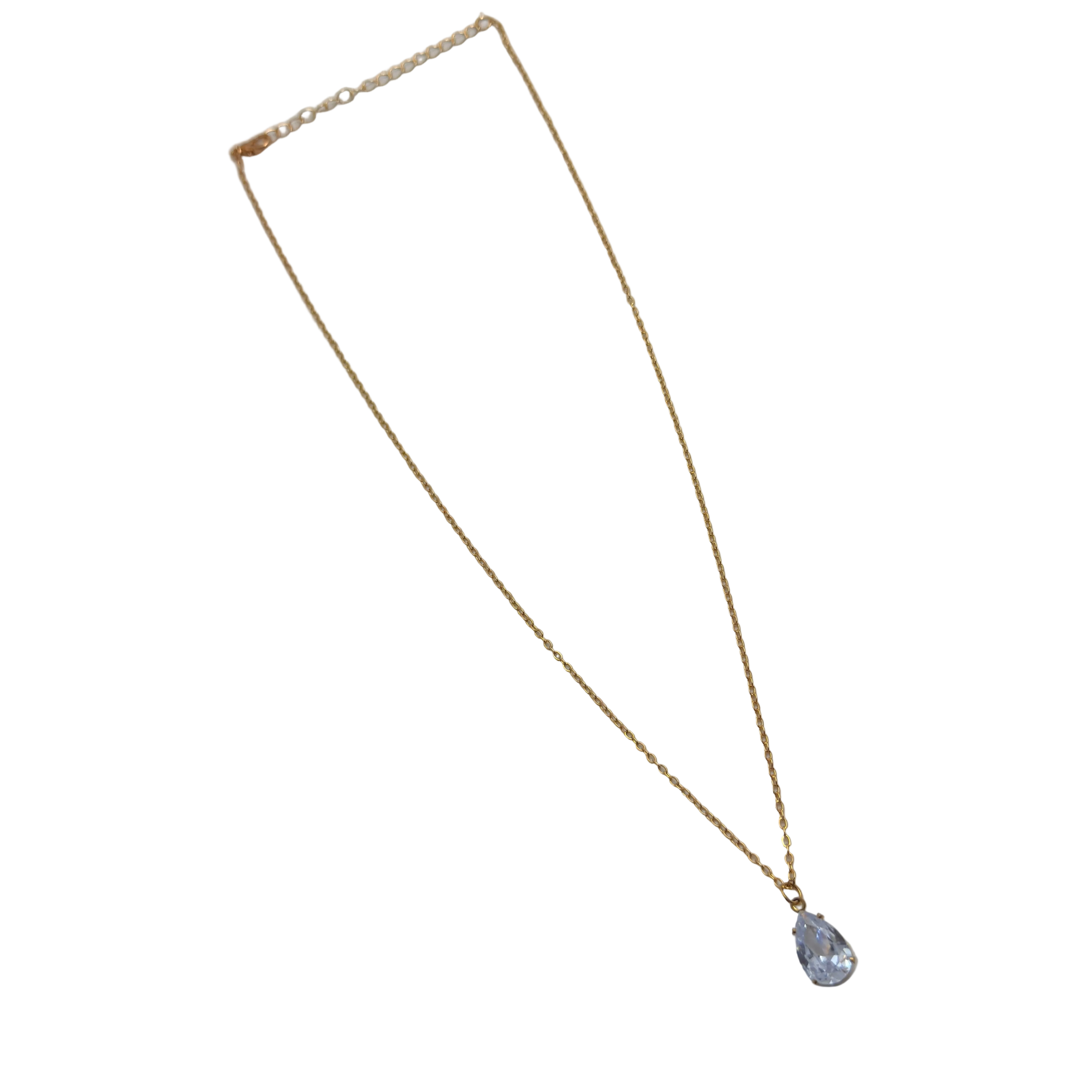 Gold-tone pendant necklace with pear-cut clear crystal solitaire, full flat-lay view