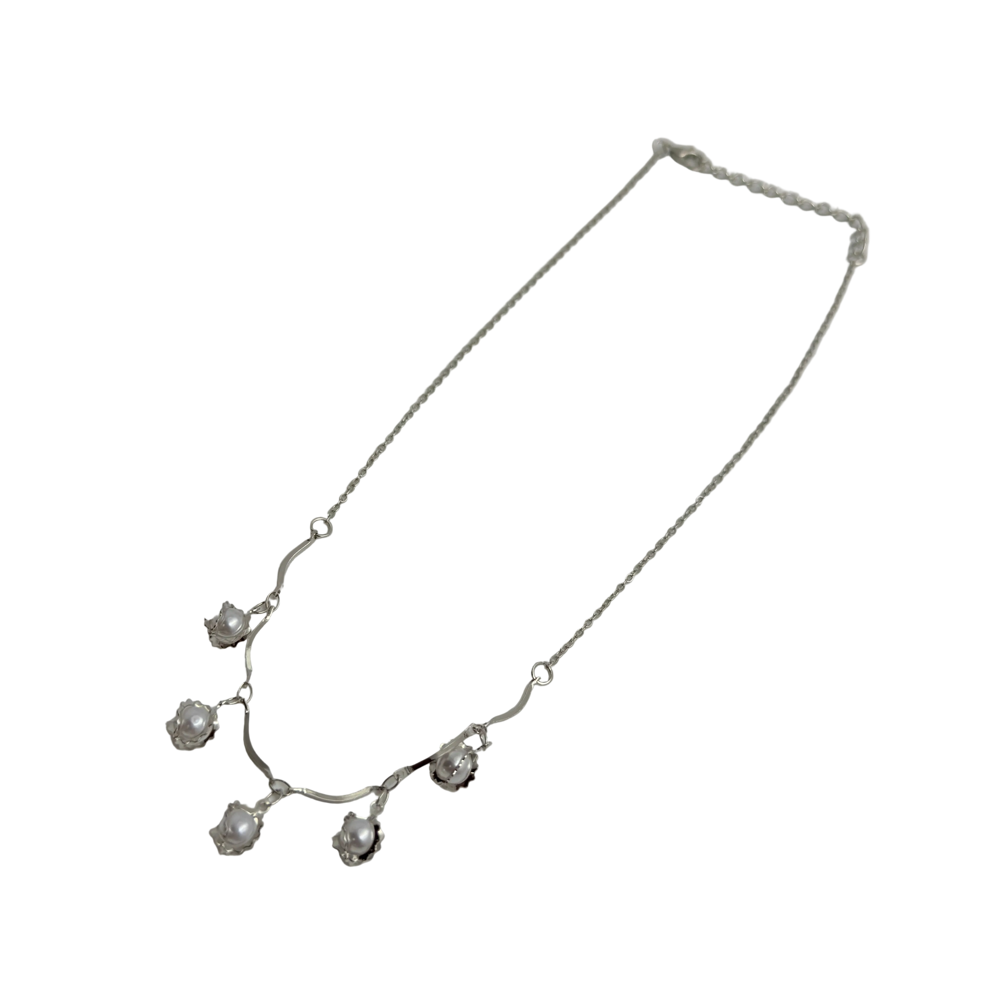 Silver-tone pearl flower bud charm necklace with cable chain, angled flat-lay view