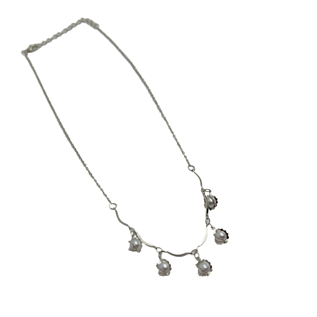 Silver-tone pearl flower bud charm necklace with lobster clasp, straight flat-lay view