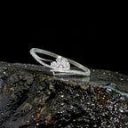 Silver-tone floral crystal cuff bracelet with pave crossover band, close-up styled shot