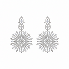 Rhodium sunburst CZ drop earrings with radiant stone-studded design, on-ear close-up shot