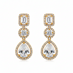 Gold crystal trio drop earrings with pave detailing, close-up on model's ear