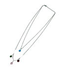 Silver-tone layered necklace with blue, green, red and pink crystal charms, full flat-lay view