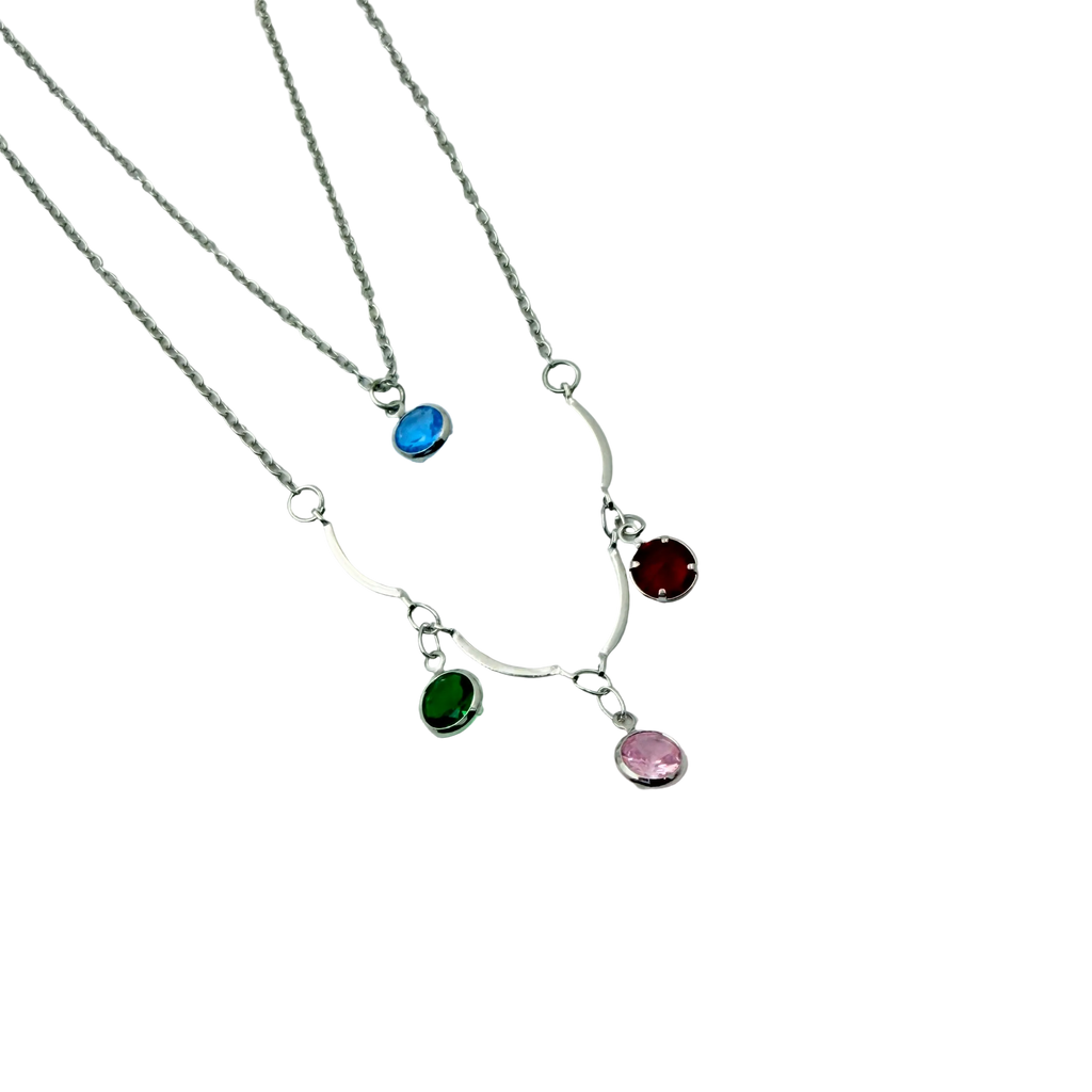 Silver-tone layered necklace, close-up of multicolor crystal charm details