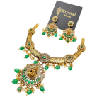 Gold necklace with green gemstones and matching earrings on a Krystal Jewels card.