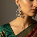 Pair of silver earrings with blue gemstones